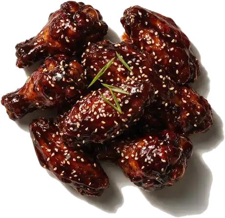 Alitas de pollo en salsa teriyaki, laca oscura con sésamo y cebollín
